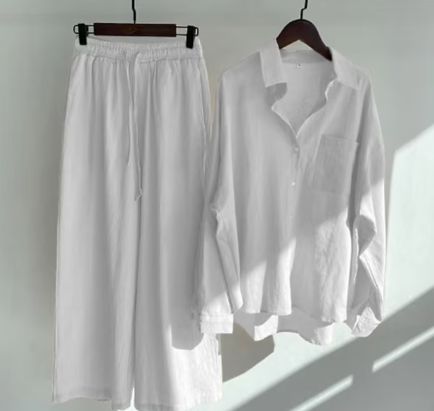 Vardaglig och stilren långärmad blus med knappar och vida byxor för kvinnor