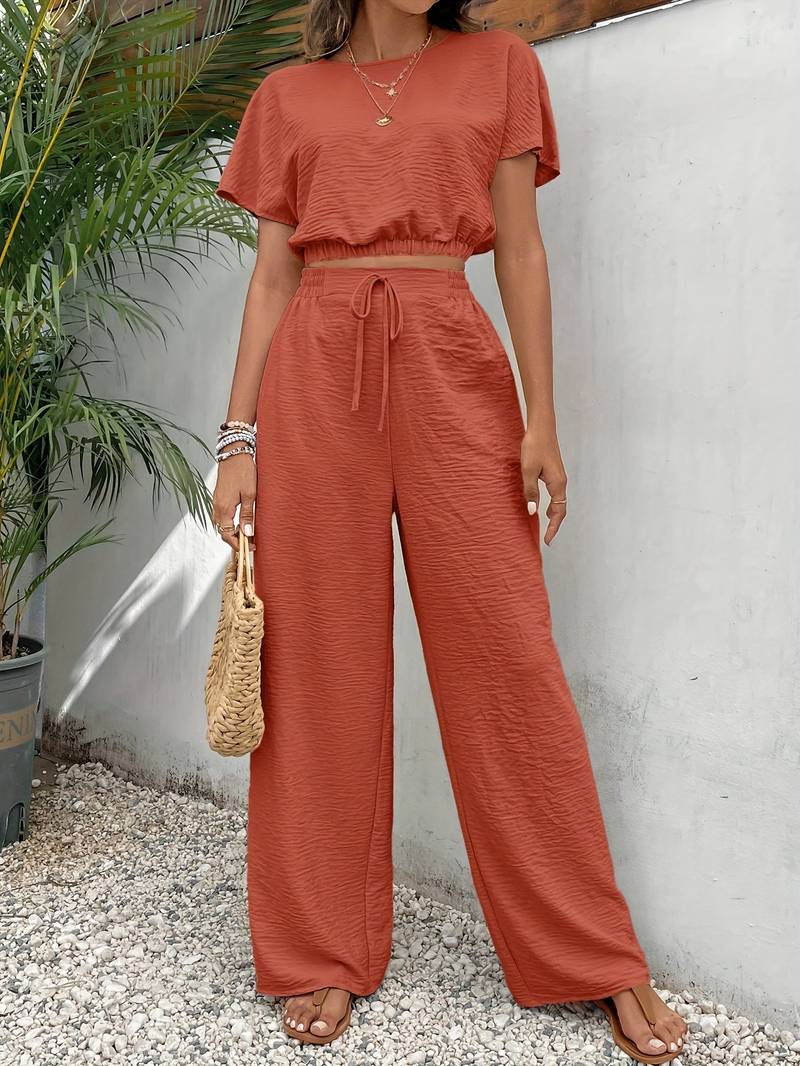 Chic crop top T-shirt och höga midje-byxor för kvinnor