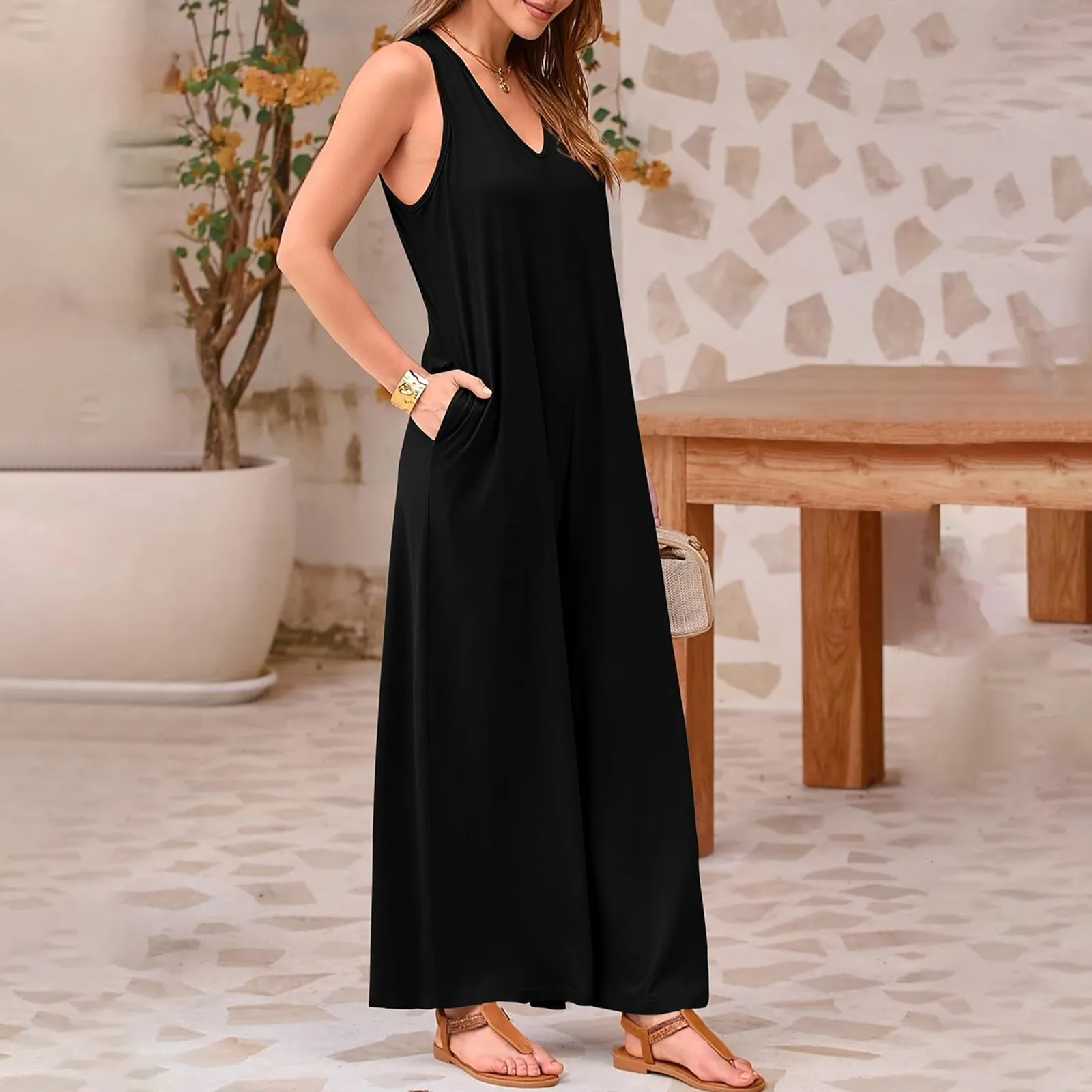 Avslappnad ärmlös jumpsuit med vida ben för kvinnor