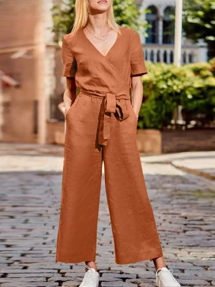 Avslappnad lös V-ringad jumpsuit med vida ben för kvinnor