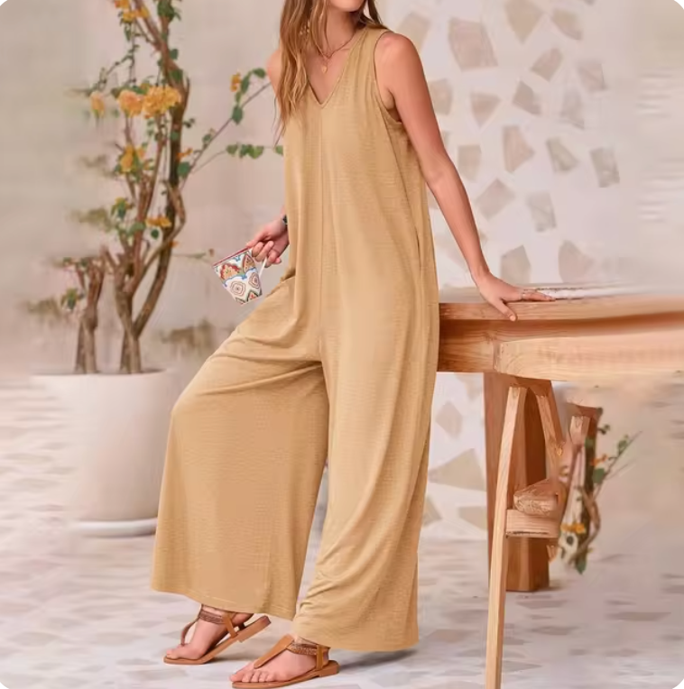 Avslappnad ärmlös jumpsuit med vida ben för kvinnor
