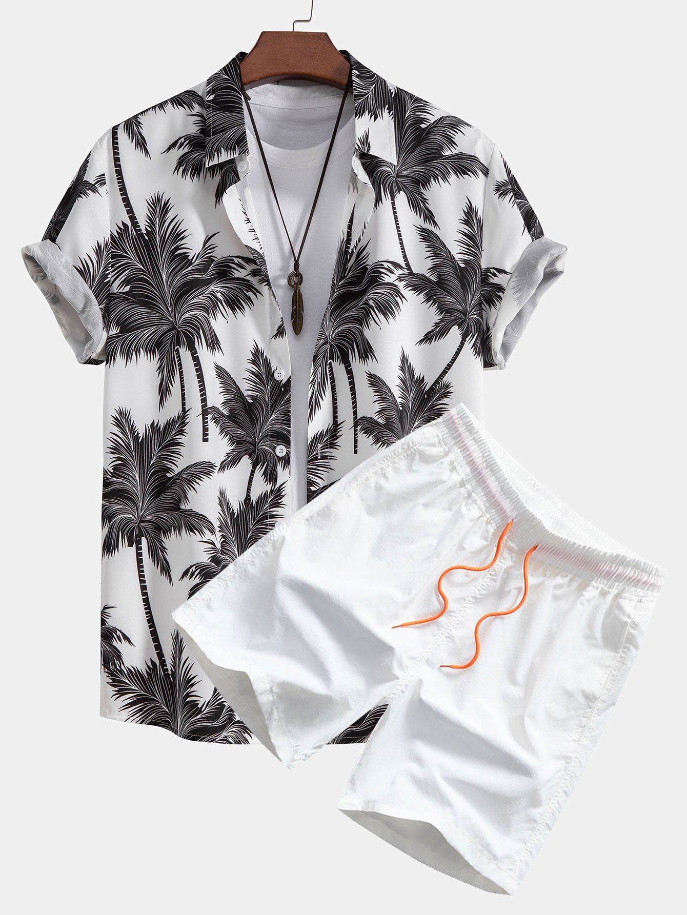 Skjorta med knappar och badshorts med palmträdstryck