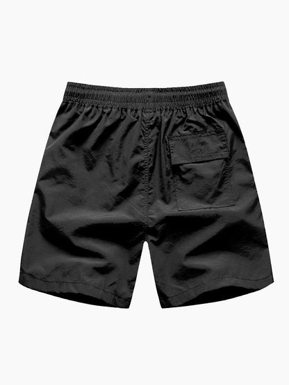 Skjorta med knappar och badshorts med palmträdstryck